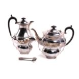 A four-piece silver teaset, oval with ovolo borders and angled handles, on four ball feet; the