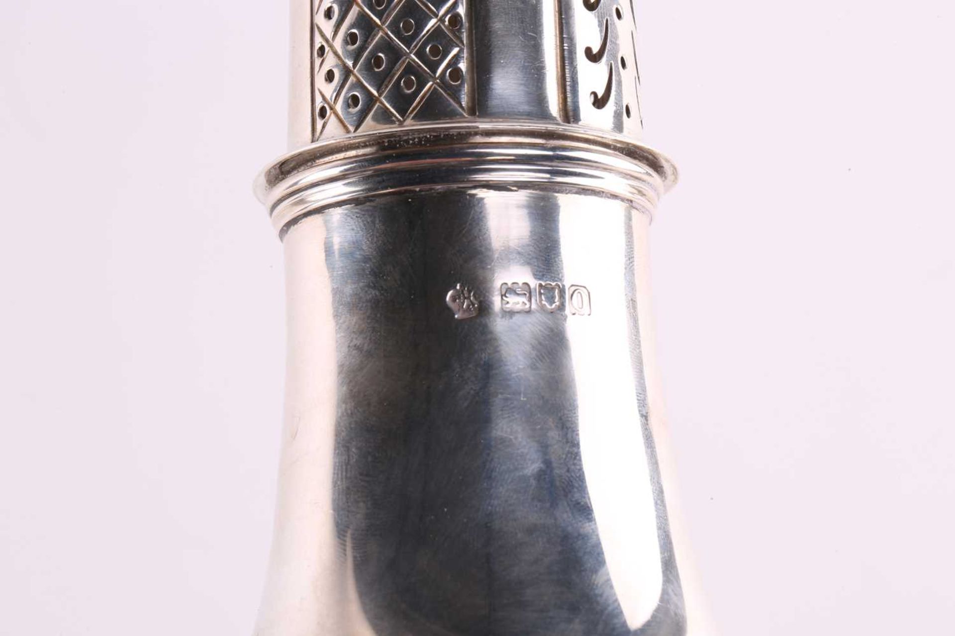 A silver sugar caster of baluster form the pull-off cover with pierced decoration and flame finial - Image 4 of 6