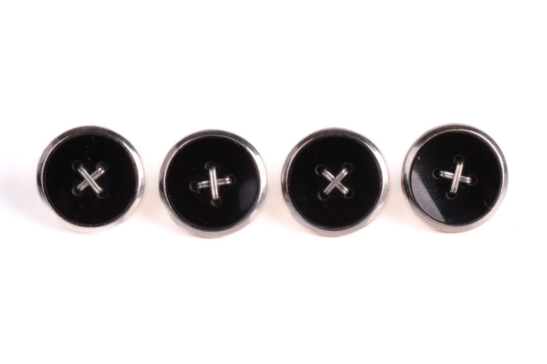 A set of four onyx and white metal dress buttons, of oval form with a roped-cross to the centre - Image 2 of 7