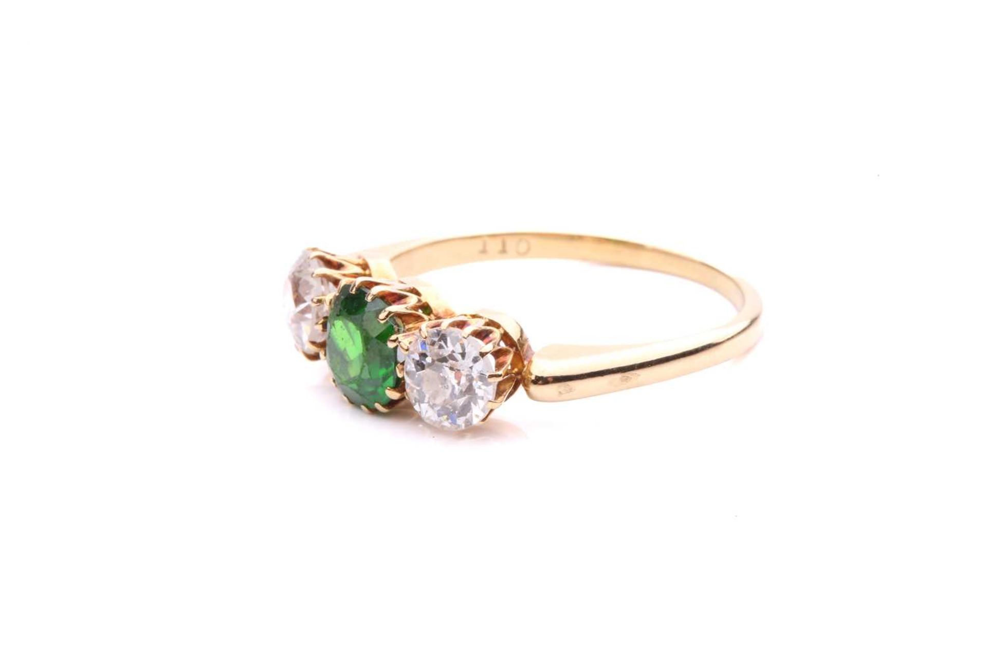 A tsavorite and diamond three-stone ring, centred with a circular-cut tsavorite in intense green - Image 2 of 5