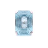 A large aquamarine solitaire ring, claw-set with an emerald-cut aquamarine in light blue colour,
