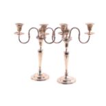 A pair of George III silver candlesticks each with detachable beaded sconces on tapering cylindrical