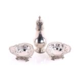 A silver sugar caster of baluster form the pull-off cover with pierced decoration and flame finial