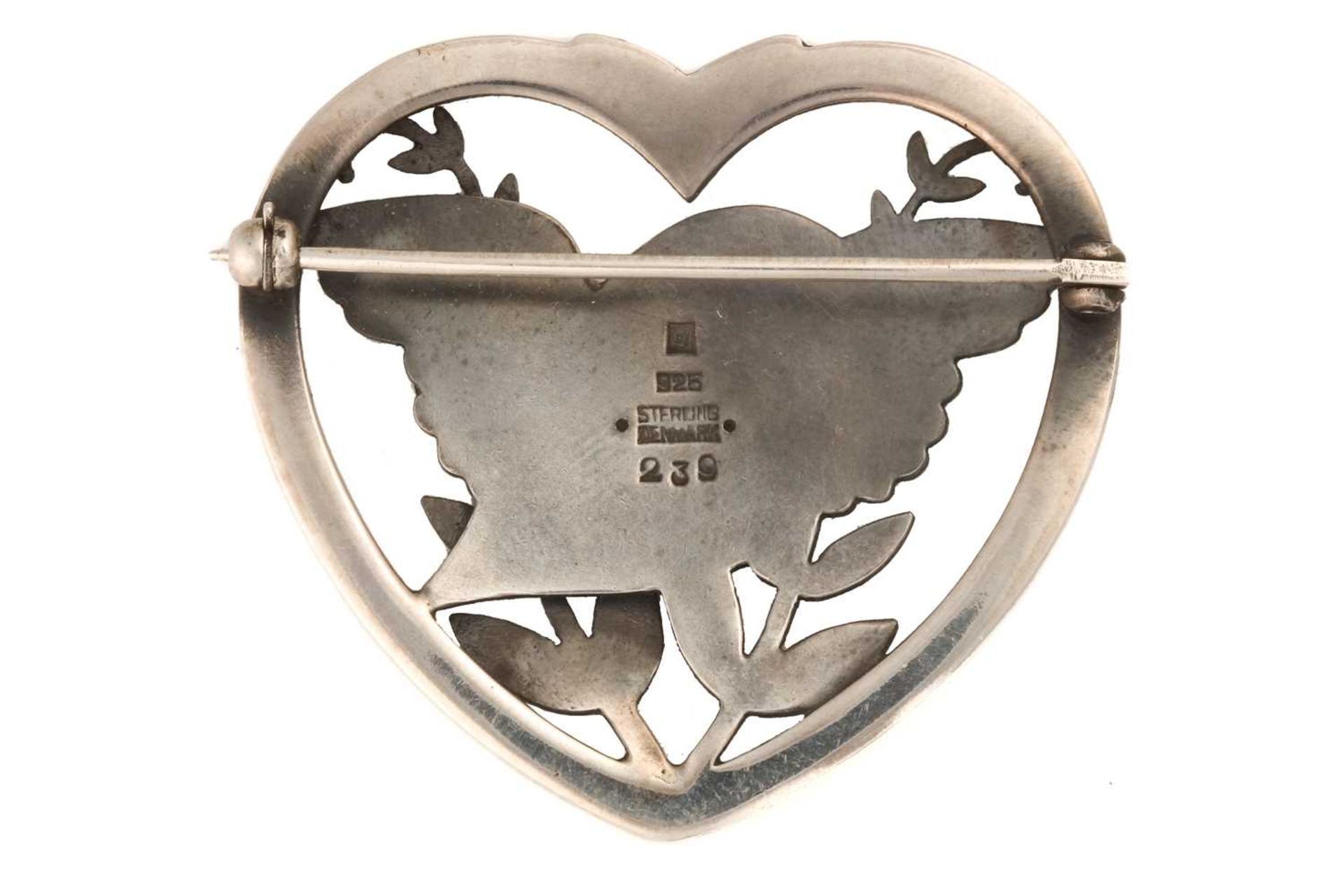 Georg Jensen - a heart-shaped brooch, depicting a flying dove with olive branches, fitted with - Image 2 of 2