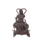 A Chinese bronze figure of Zhenwu, seated wearing body armour and a sword in his left hand, a