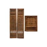 A matched pair of 19th-century teak Haveli screen doors with pierced Arabeques and spindle