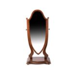 An Edwardian mahogany chevalier dressing mirror with lyre shaped supports and shield mirror,
