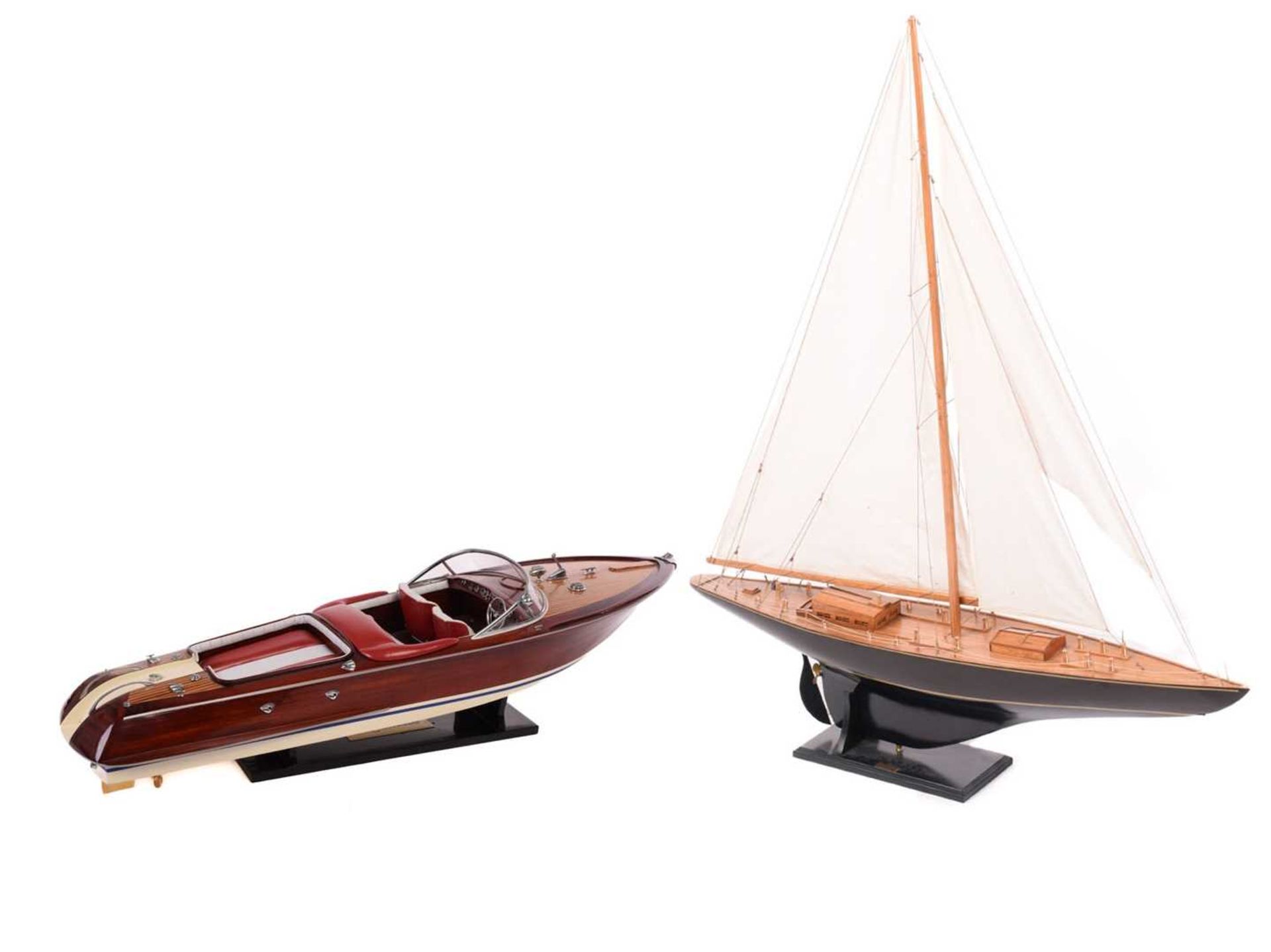 A painted and stained wood model of the yacht 'Endeavour', with fabric sales and rigging on a titled