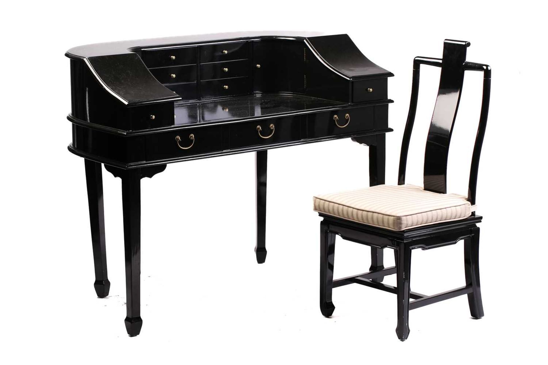 A black lacquered Carlton House-type writing desk, 20th century, fitted with a bank of short drawers