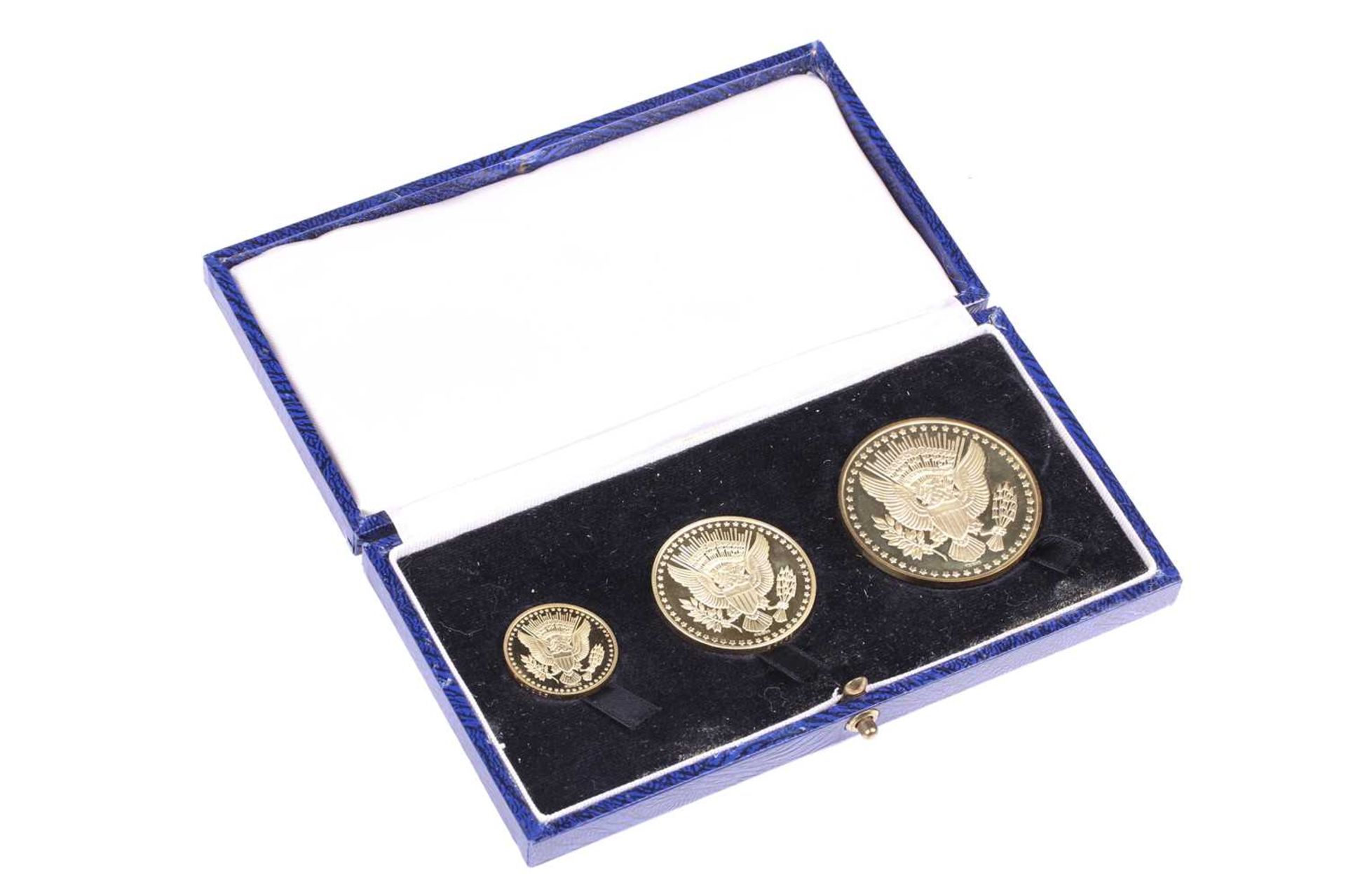 A President John F Kennedy memorial gold medal set, circa 1965, comprising three medals in 18ct