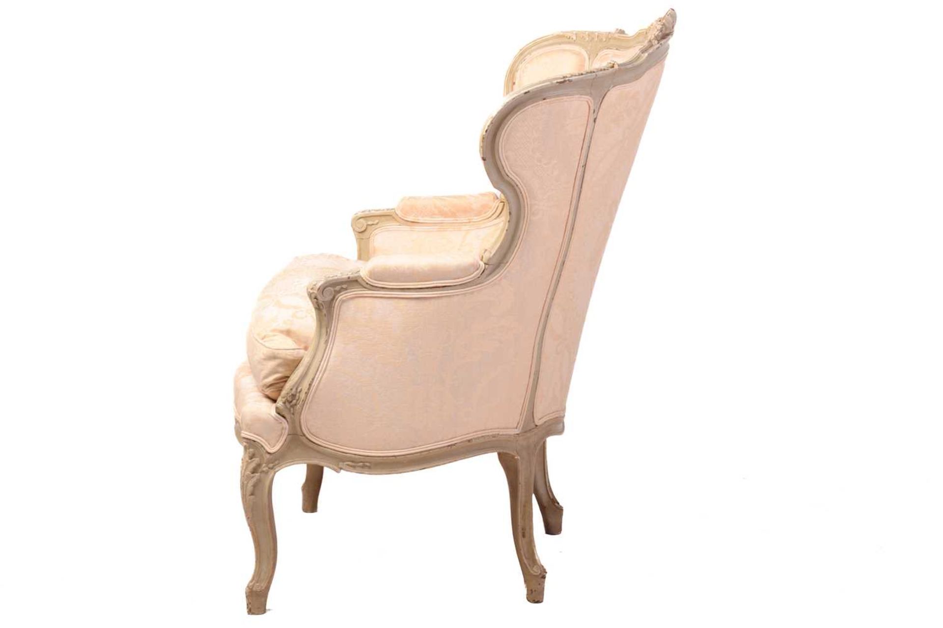 A French Louis XV-style dove grey painted bergere armchair with wing back and carved shell - Image 4 of 8