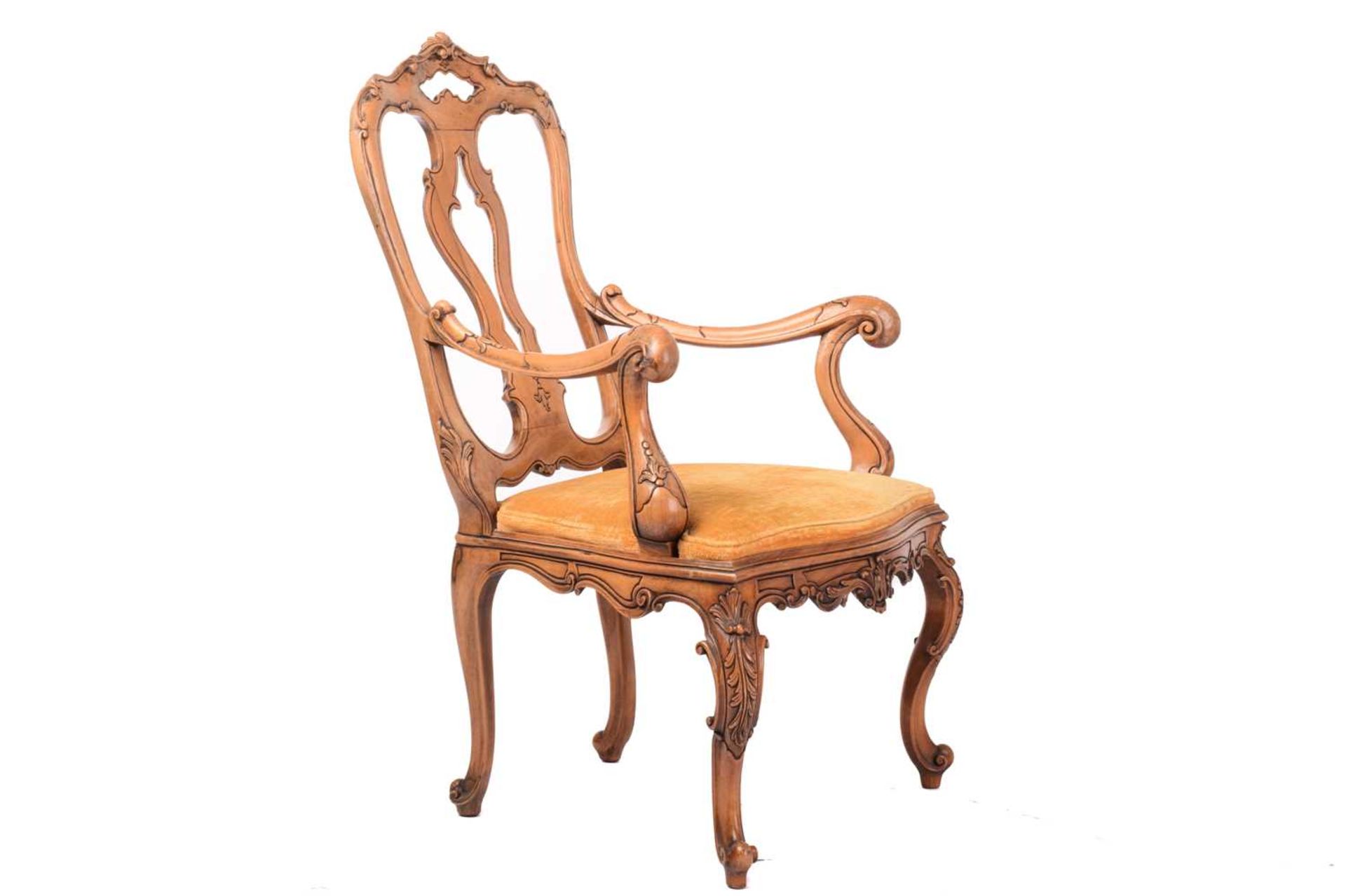 An 18th-century Venetian style carved walnut open armchair, 20th century with shaped spoon back