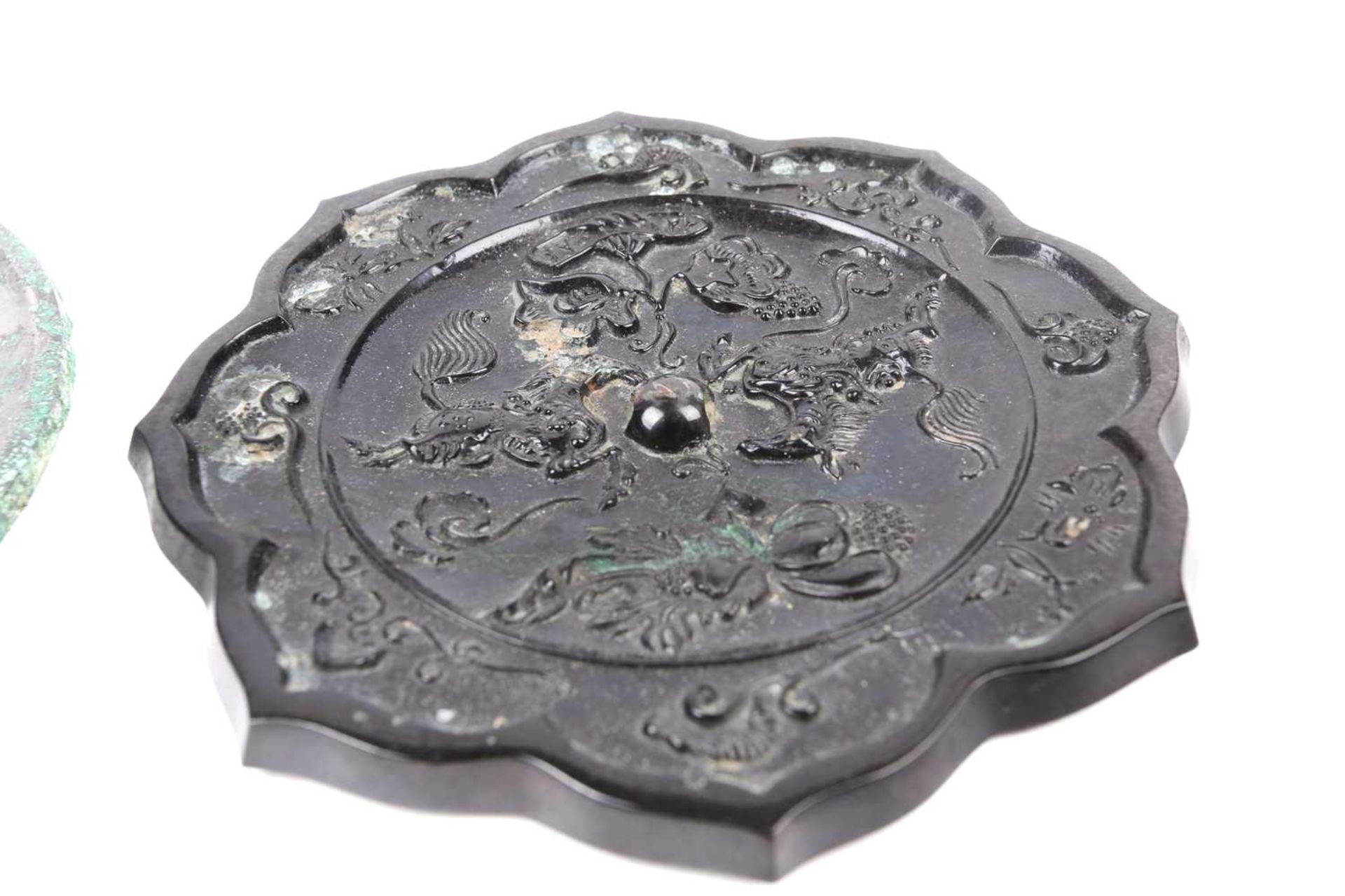 A Tang style bronze mirror, relief cast with two opposing horses, amongst lotus and gourds, the - Image 3 of 5