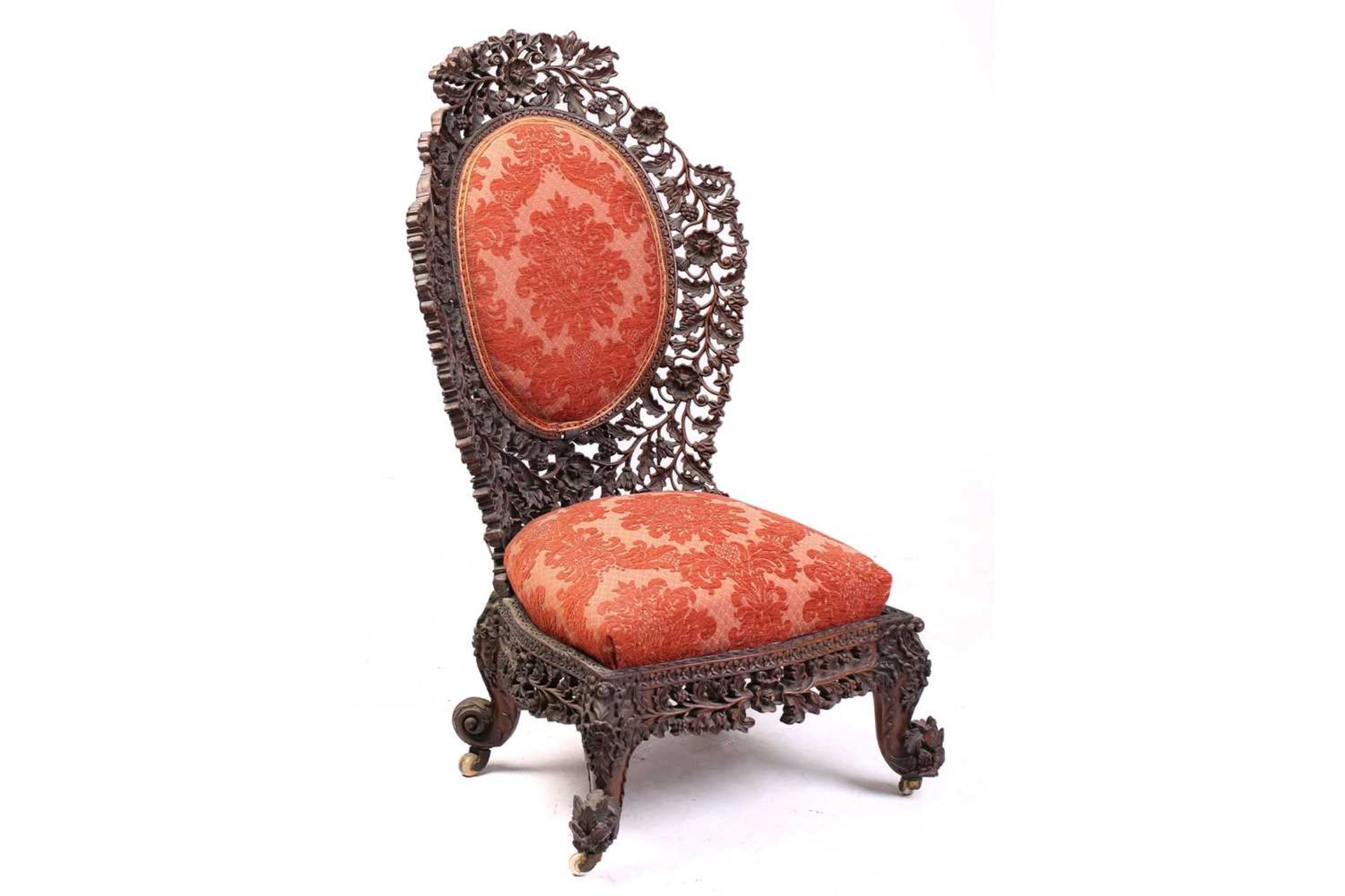 In the manner of The Ahmedabad Carving Company; an Anglo-Indian/ Burmese padauk wood slipper