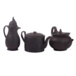 Three items of late 18th century Wedgwood black basalt ware, comprising a teapot and water pot, of