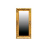 A 19th century style rectangular gilt framed wall mirror, 20th/21st century, with deep bevelled