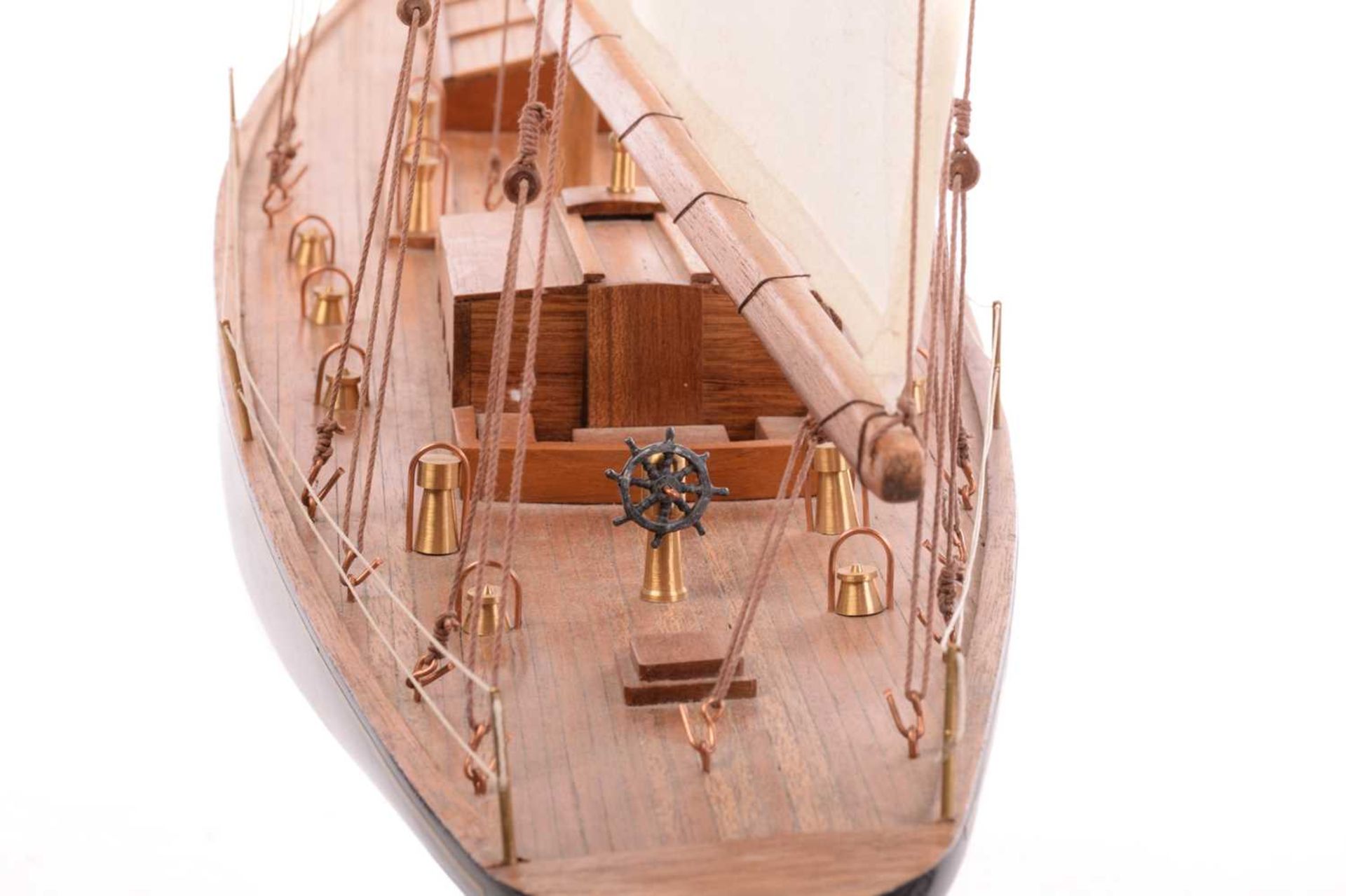 A painted and stained wood model of the yacht 'Endeavour', with fabric sales and rigging on a titled - Image 9 of 16