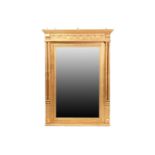 A Georgian style giltwood mirror, 20th century, the rectangular glass beneath a cavetto pediment and