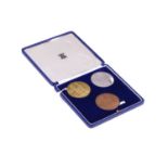 A Royal Mint commemorative three-medal set: 900 Years of Westminster Abbey (1065-1965), in 22ct