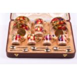 A Royal Worcester porcelain coffee service with silver spoons, in a fitted Asprey case, each piece