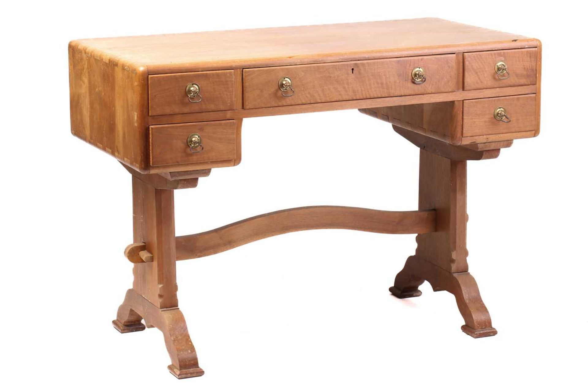 A walnut writing table, probably of the workshops of Arthur Romney Green, C.1925 the five drawers