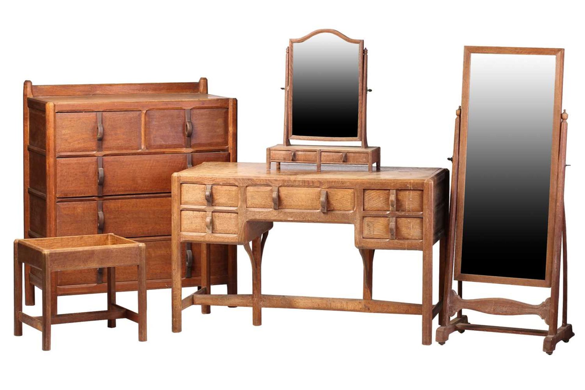 A Gordon Russell bedroom suite in English brown oak, c.1925, comprising: a dressing table with