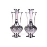 A pair of WMF chrome metal twin-handled spill vases, circa 1900, the bulbous bodies with embossed
