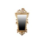 A late 19th century Art Nouveau gilt framed mirror, the bevelled glass within a moulded plaster