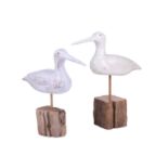 In the manner of Guy Taplin (b.1939), two white-painted wooden birds on stands, the tallest 34 cm