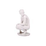 A Rosenthal ceramic figure titled ‘Die Hockende’, circa 1950, a crouching female nude, designed by