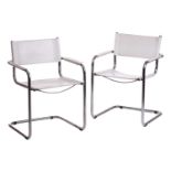 A pair of mid-20th century chrome and white leather cantilever armchair after a design by Marcel