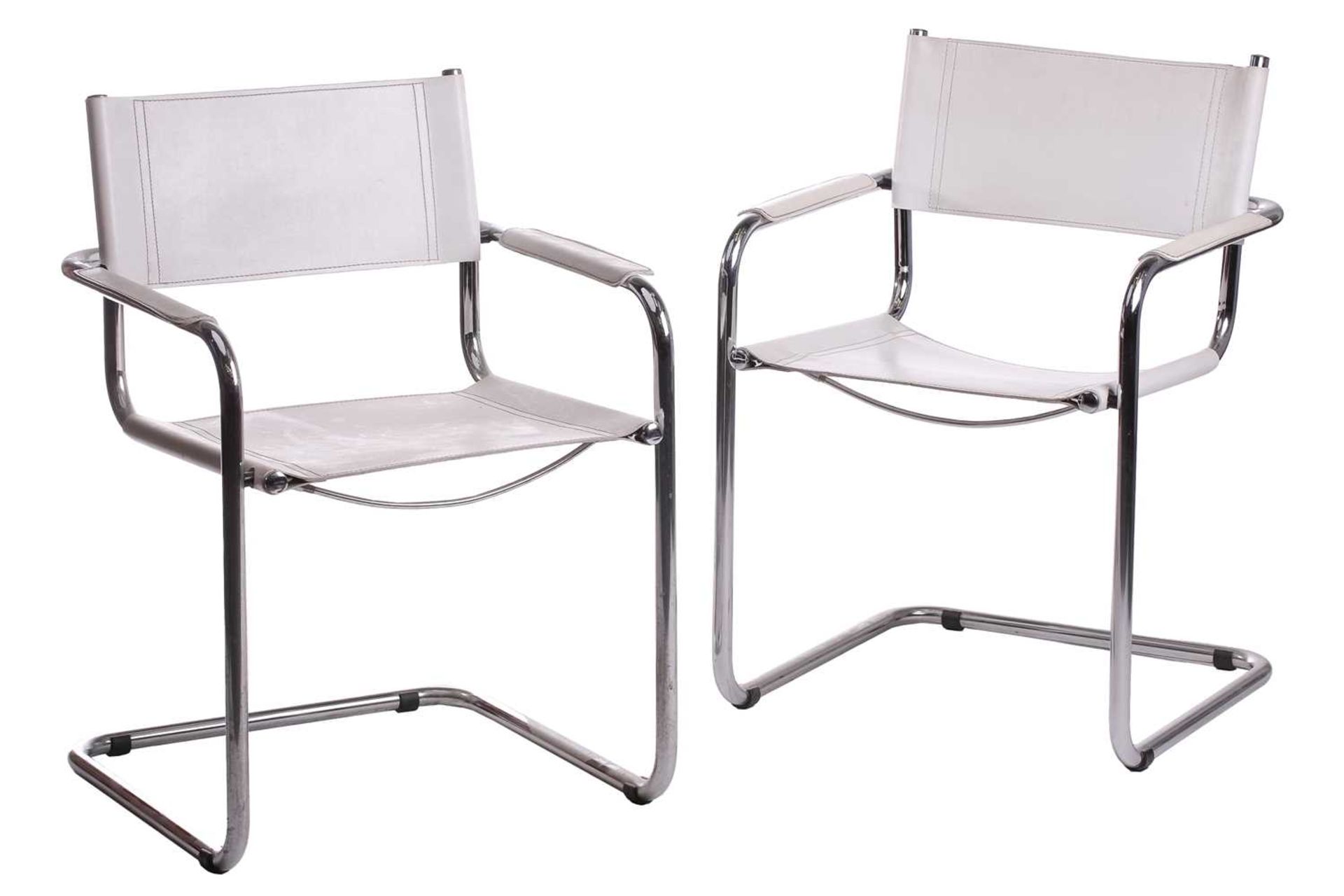 A pair of mid-20th century chrome and white leather cantilever armchair after a design by Marcel