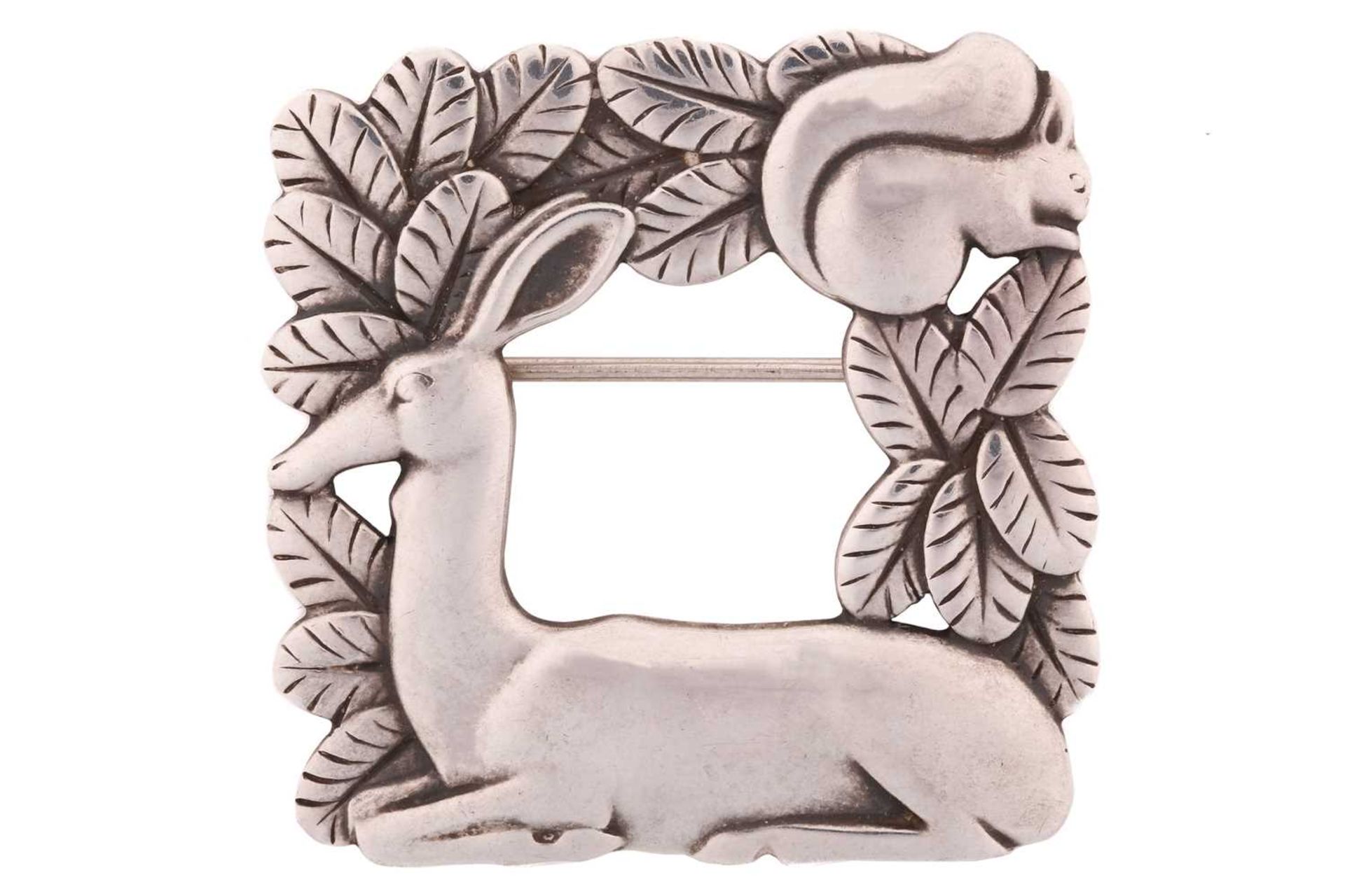 Georg Jensen; a 925 sterling silver square openwork brooch, featuring a resting deer and squirrel in