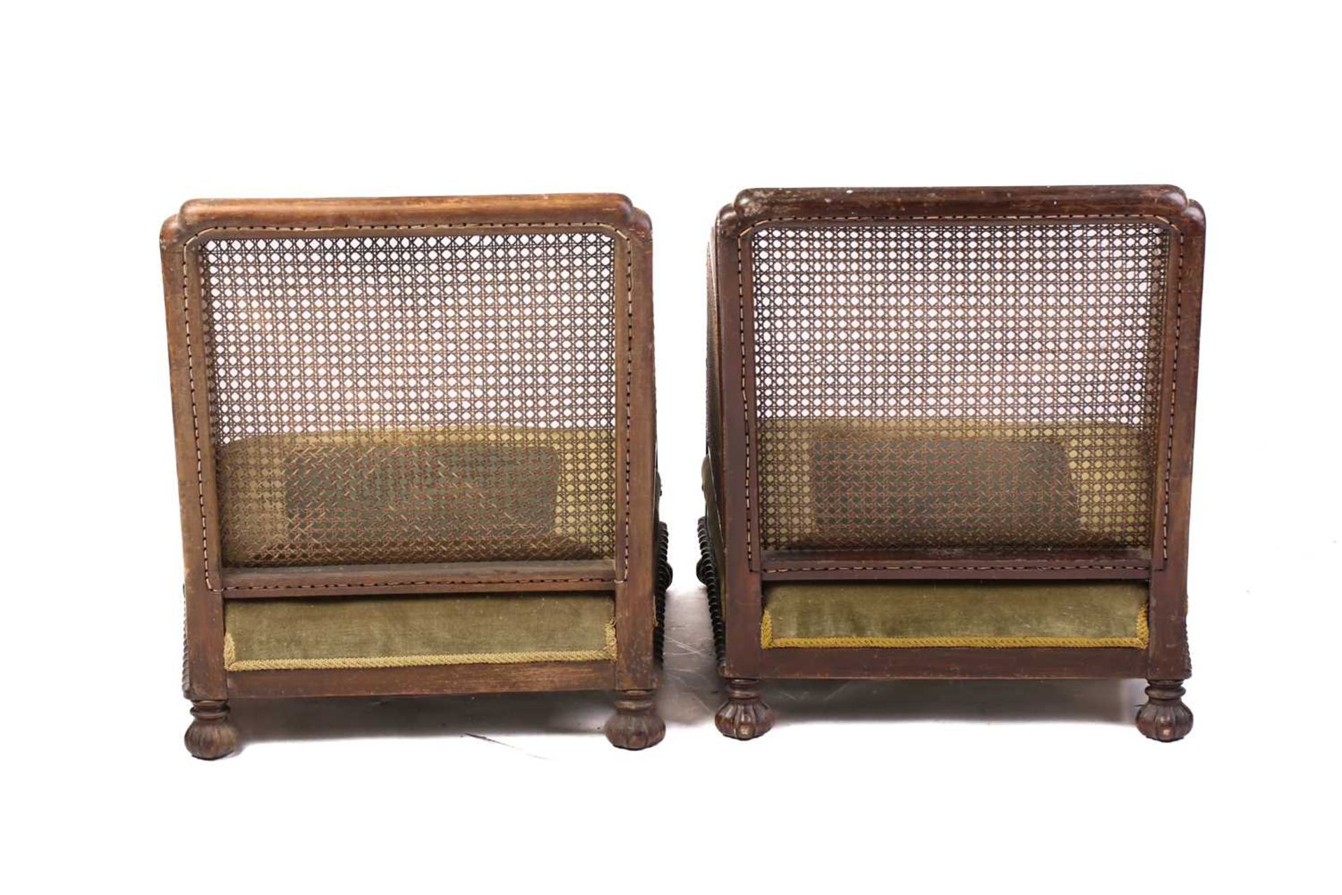 A pair of 1920s oak cane back bergere armchairs, with carved frieze decoration, lacking cushions, 74 - Image 7 of 9