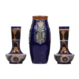 A pair of late 19th century Fulham Pottery stoneware vases, of tall-necked belly form, with