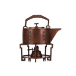 An early 20th century Arts & Crafts style WMF planished copper and brass spirit kettle, burner and