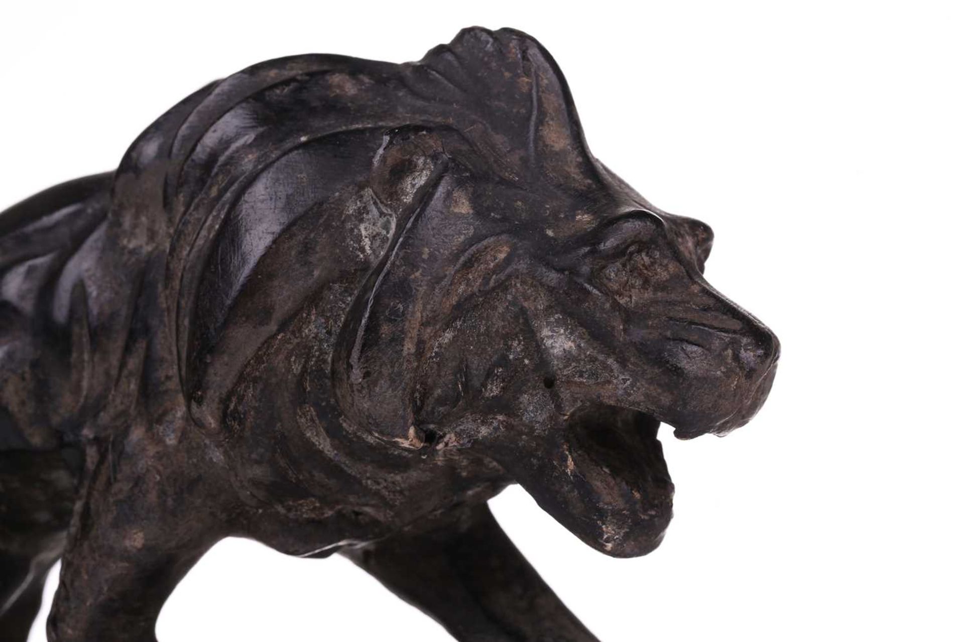 J. Colombini, a patinated composite sculpture of a lion on a rock outcrop, incised signature with - Image 5 of 7