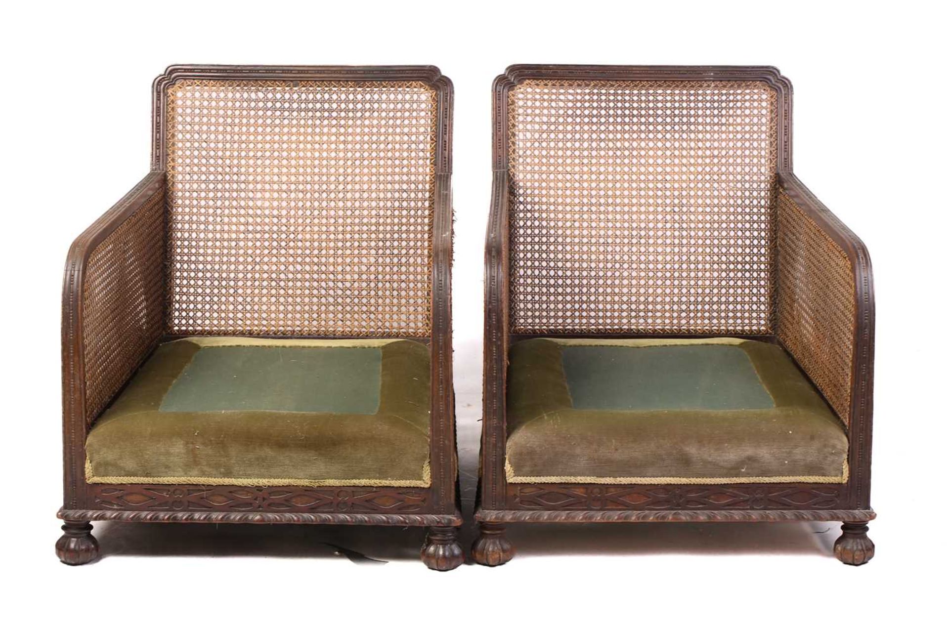 A pair of 1920s oak cane back bergere armchairs, with carved frieze decoration, lacking cushions, 74 - Image 9 of 9