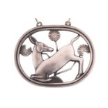 Georg Jensen; a 925 sterling silver pendant, openwork design of a kneeling deer and flowers,