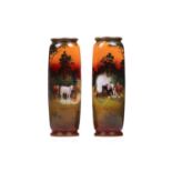 A near pair of very large Royal Doulton cylindrical vases, each decorated with animals in
