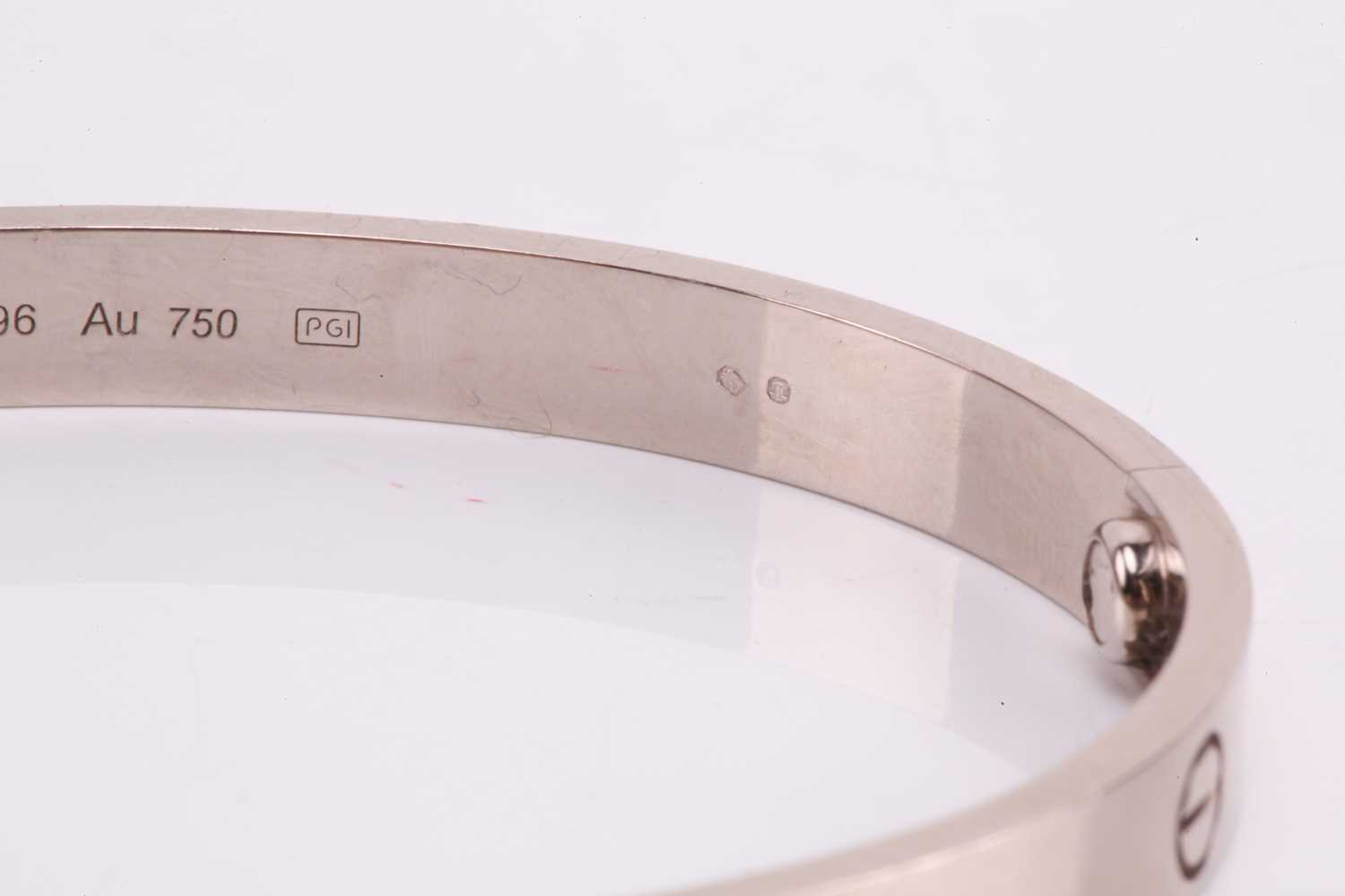 Cartier - a 'LOVE' bangle in 18ct white gold, composed of two rigid arcs with screw motifs, - Image 12 of 17