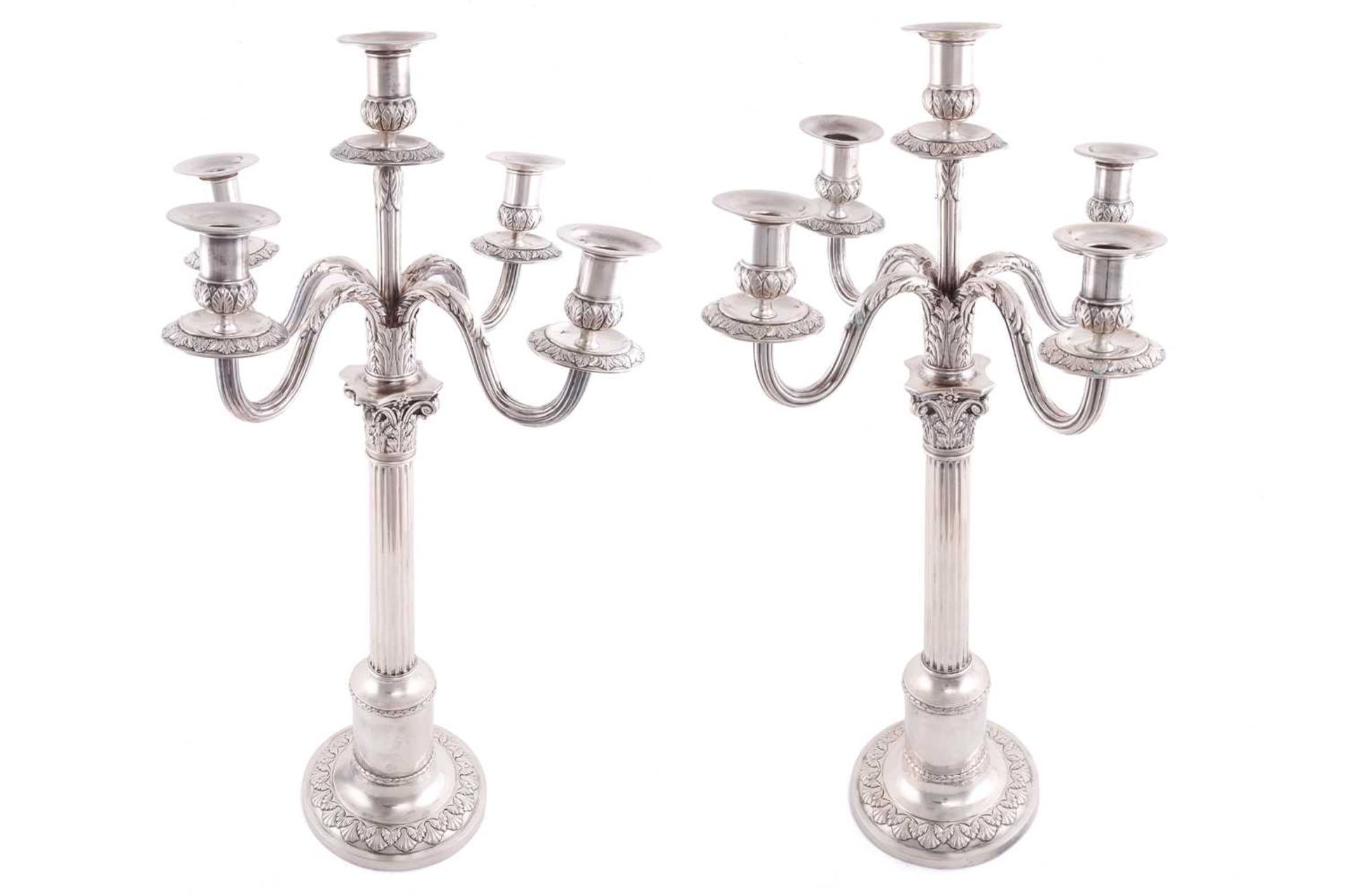 A pair of German 800 standard candelabra, of Corinthian column form with detachable five branch
