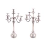 A pair of German 800 standard candelabra, of Corinthian column form with detachable five branch