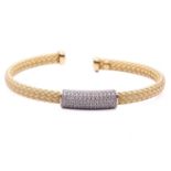 A wire mesh bangle featuring a central panel pavé set with colourless stones, in yellow metal