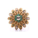 An emerald and diamond flowerhead dress ring, of bombé design, centred with a cluster of a single-