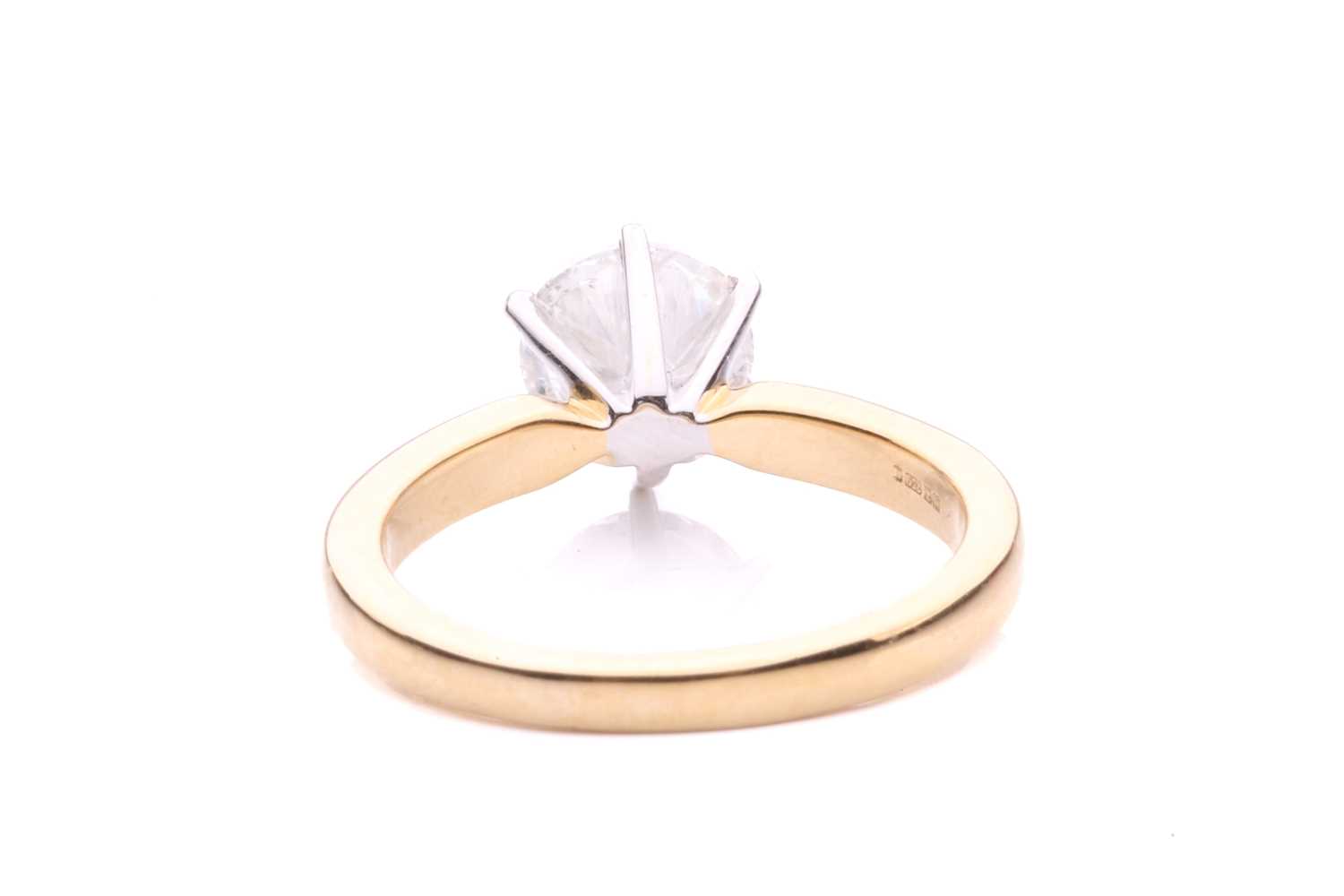 A diamond solitaire ring in 18ct gold, centred with a brilliant-cut diamond of 6.7 mm with an - Image 5 of 5