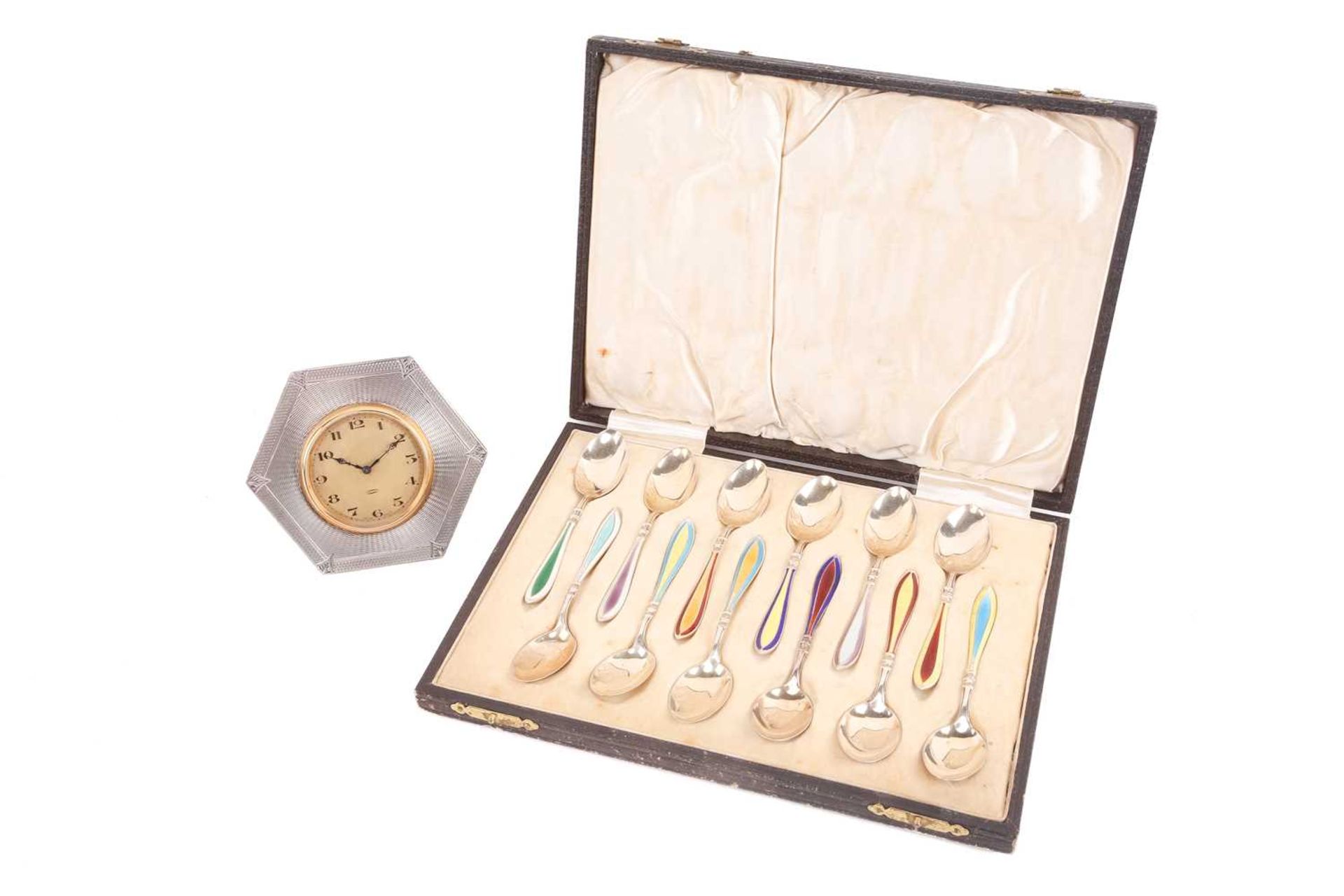 A cased set of twelve "Sterling" gilded and enamel coffee spoons each with contrasting coloured