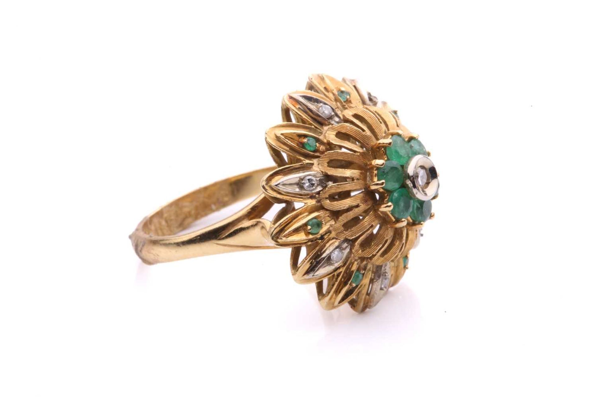 An emerald and diamond flowerhead dress ring, of bombé design, centred with a cluster of a single- - Image 3 of 5