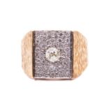 A diamond-set panel ring, the rectangular plaque centred with an old-cut diamond circa 0.30ct, set