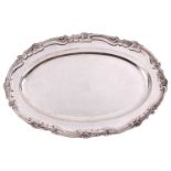 An Austro Hungarian silver platter; oval with raised scroll and shell decorated border; slightly